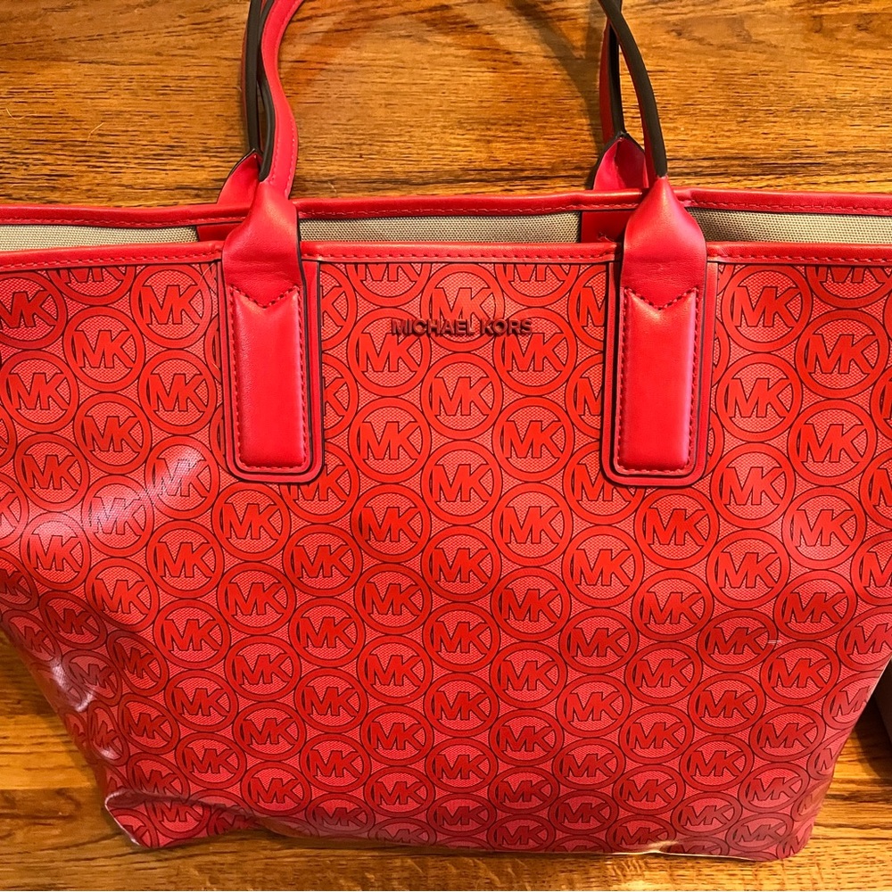 Red Michael Kors bag with purse organizer
